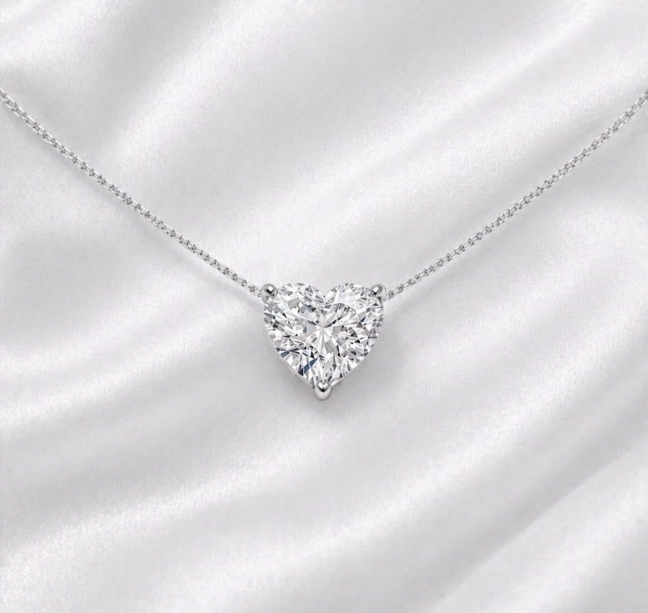 Heart diamond necklace on satin